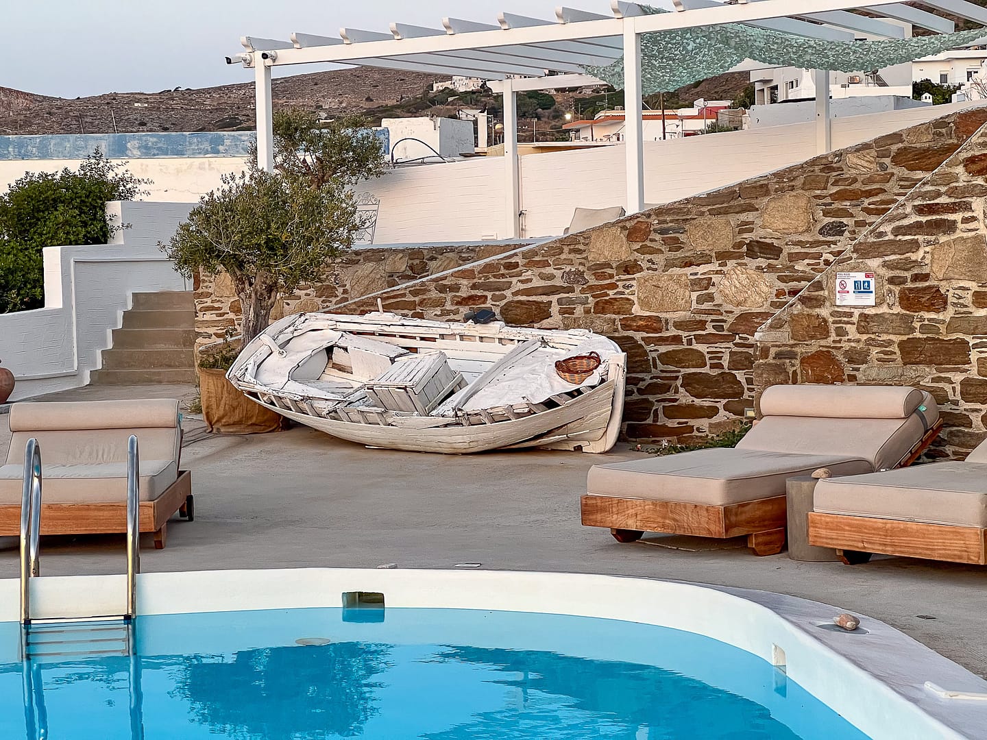 The pool and sun terrace at Pino Di Loto Syros