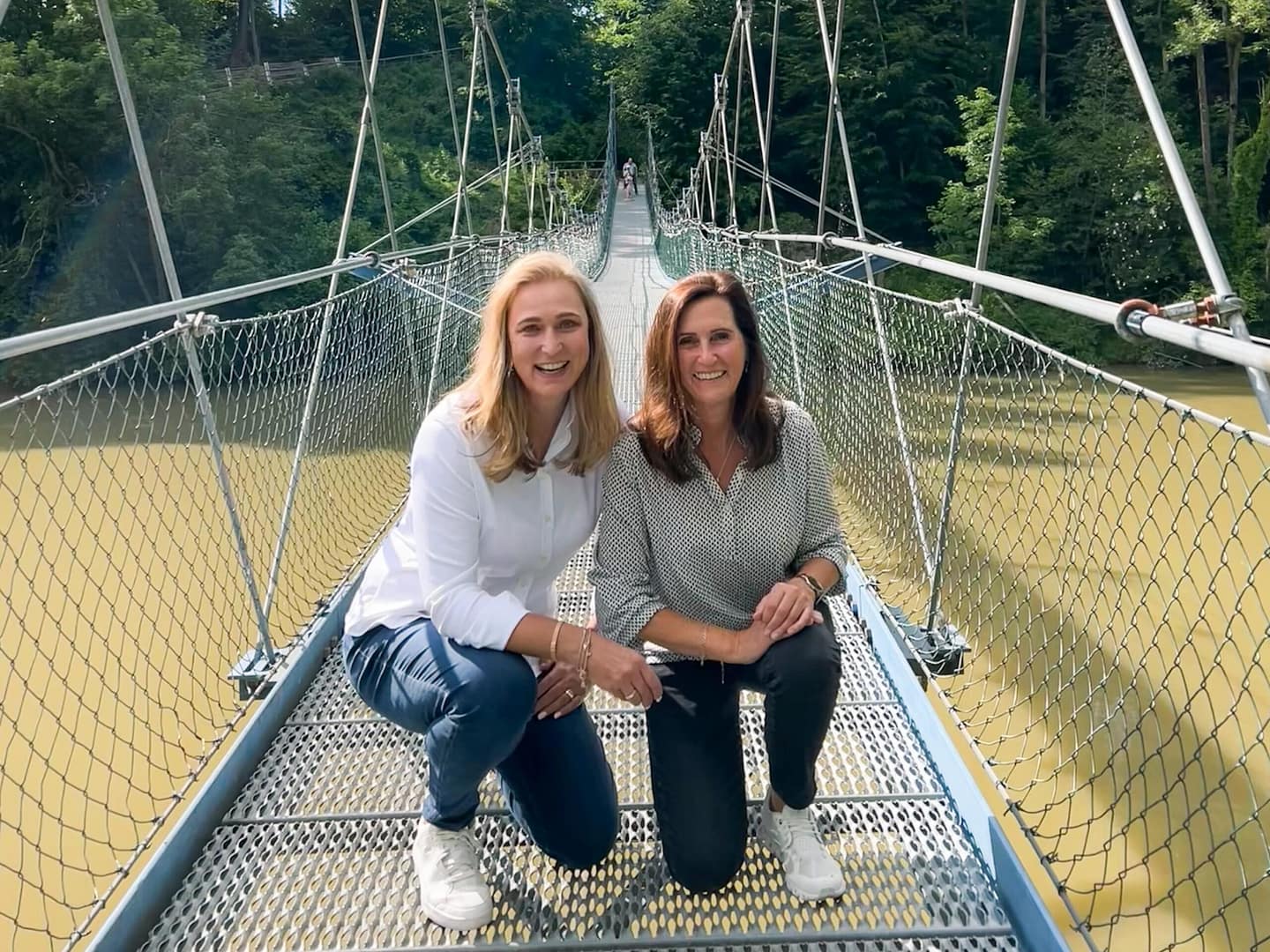 two women on bridge over river. Iller Brücke. How to start a travel blog