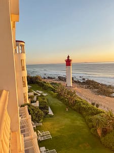 Sunrise view over lighthouse at the Oyster Box Hotel, Kwa-Zulu Natal group tour