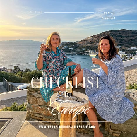 Ladies sitting on the edge of a pool in Syros Greece