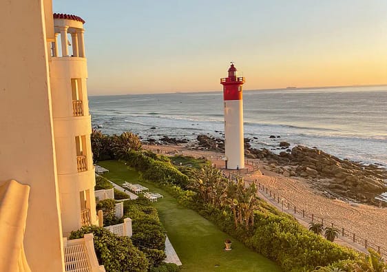 Sunrise view over lighthouse at the Oyster Box Hotel, Kwa-Zulu Natal group tour