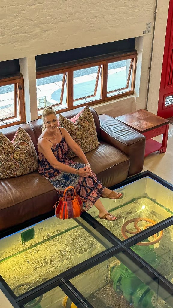 The reception area of the Turbine Hotel, with glass floor featuring the original turbine engines below