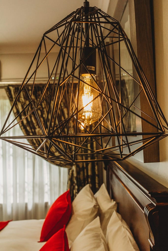 Modern lamp shade made of bronze steel frame for a bedroom