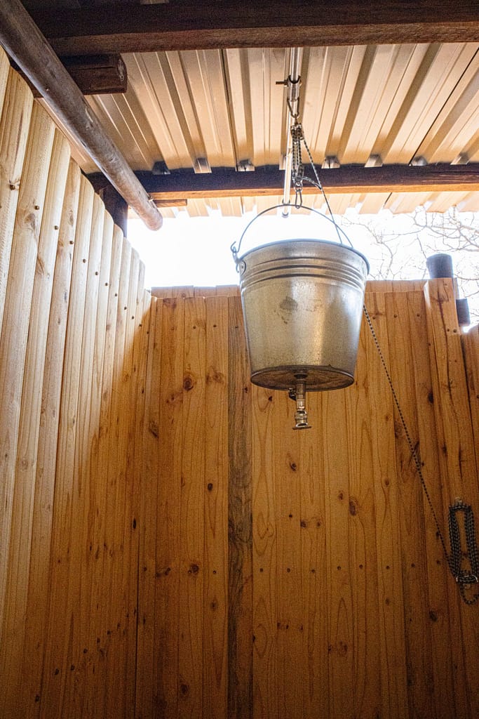 A bucket water system shower