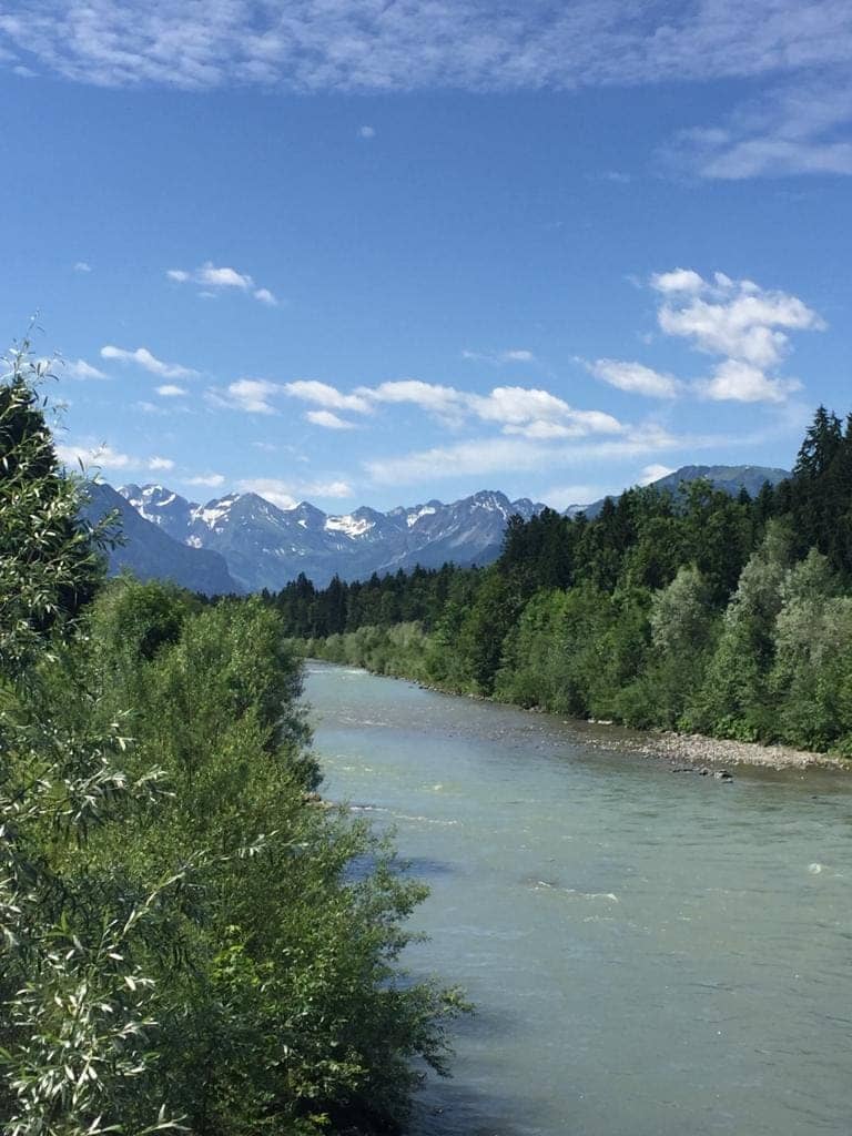 Travelbuddieslifestyle in Oberstdorf cycling the Iller- Radweg river with the Alps