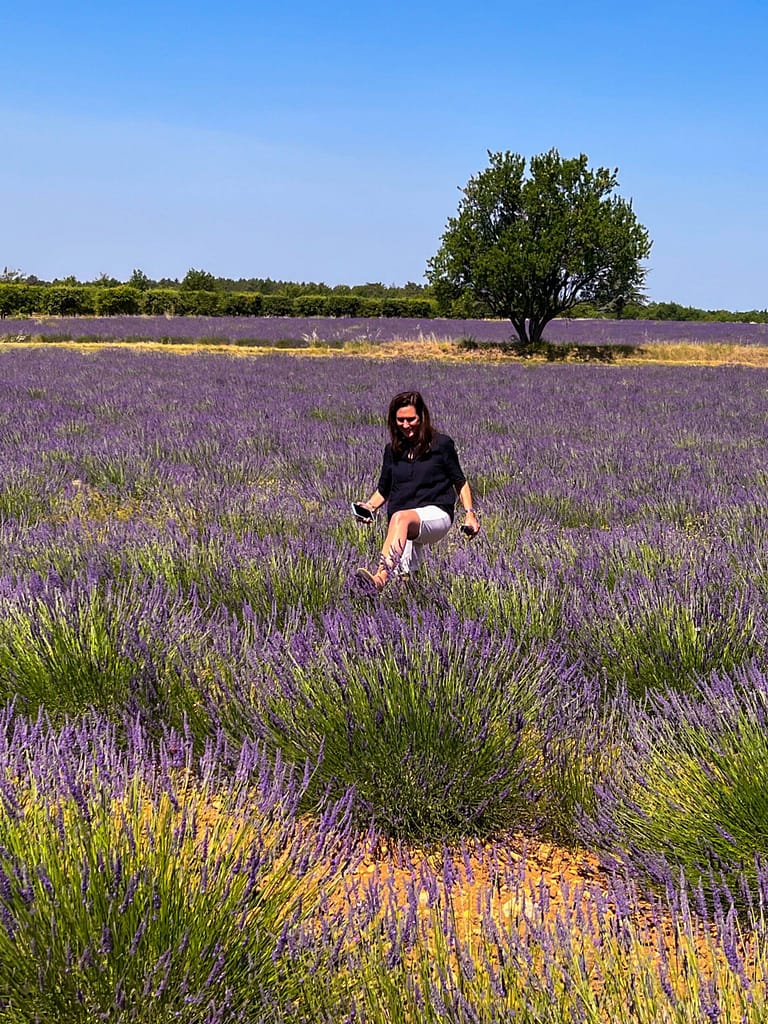 A lady walking in the lavender fields in Provence