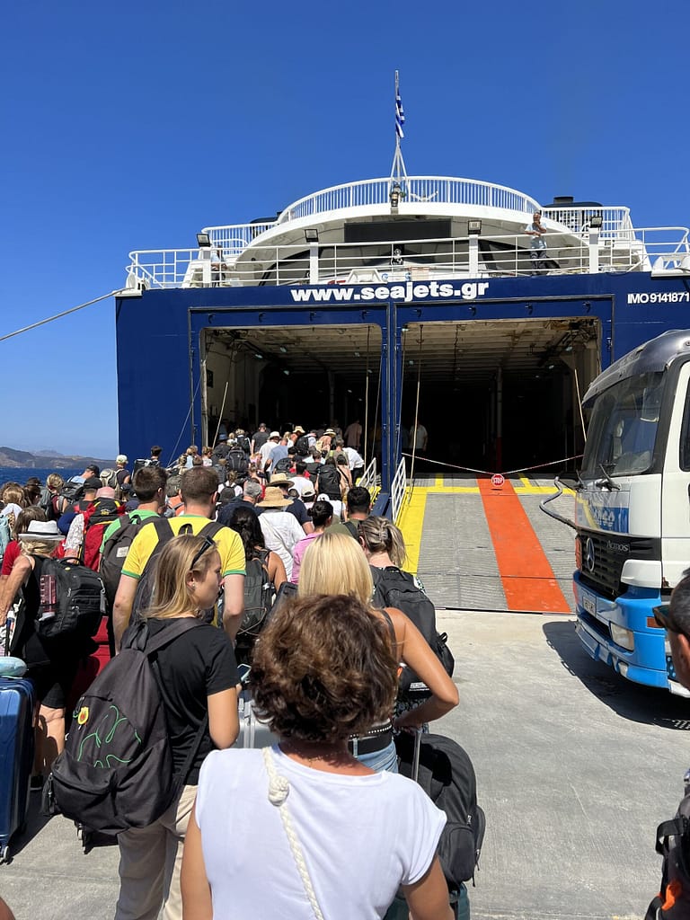 People getting onto a Greek ferry