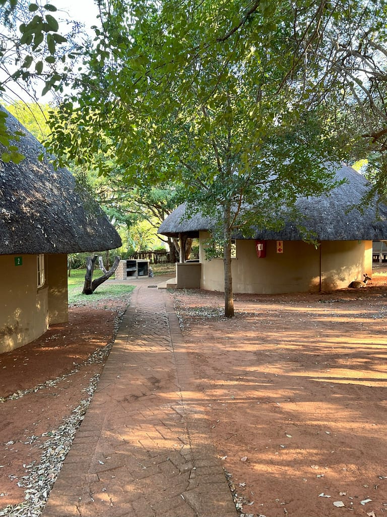 Thatched bungalows at Crocodile Bridge rest camp