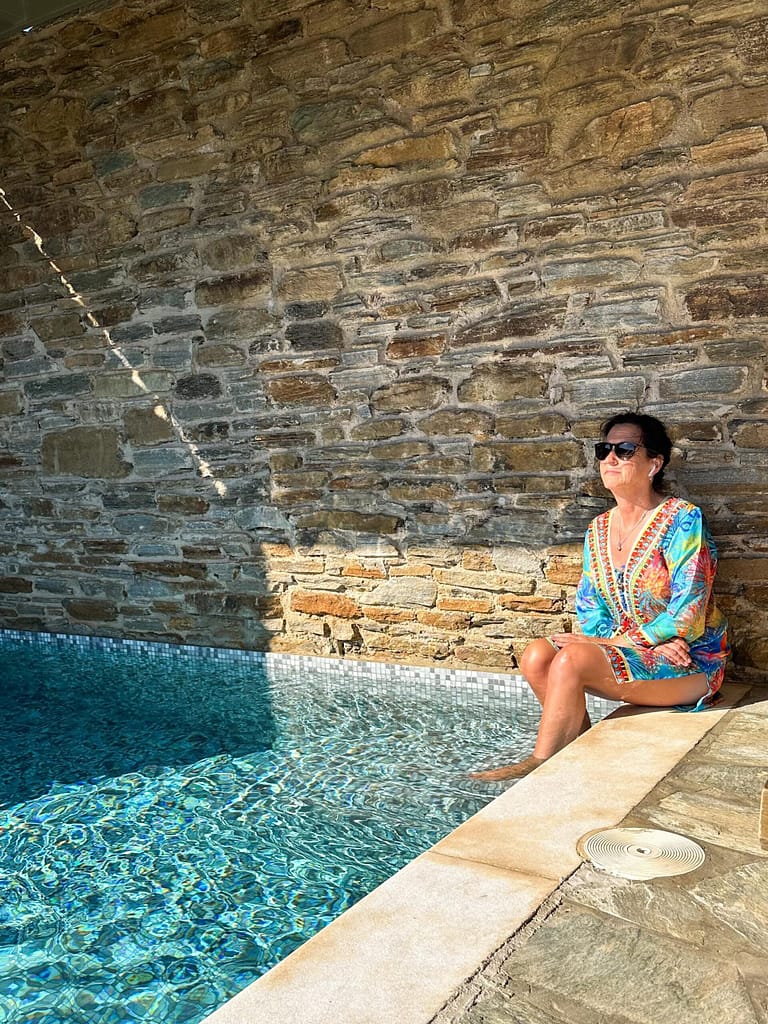 Hotel Review Aeolis Tinos Suites. Hotel Tinos. Woman at pool