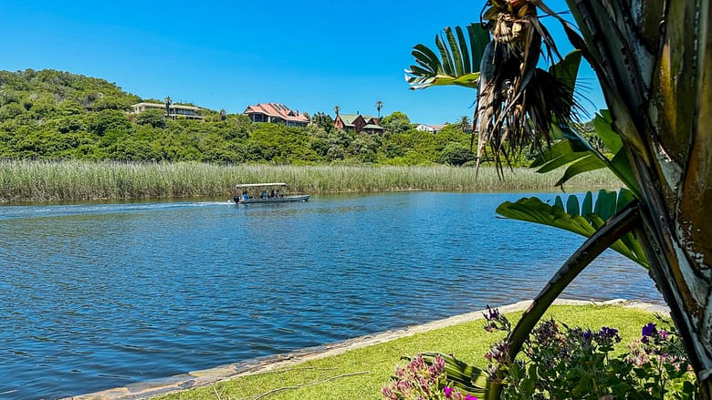 Wilderness, South Africa, Garden Route river views and little boat cruising by
