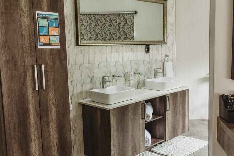 Well appointed bathroom with double vanities of Iso Bella Vita Guest House in Phalaborwa
