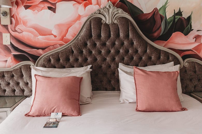 A beautifully appointed soft pink double suite in the Isobela vita guest house