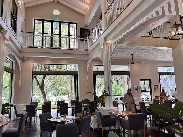 The open-plan indoor dining area of the Palm River Lodge