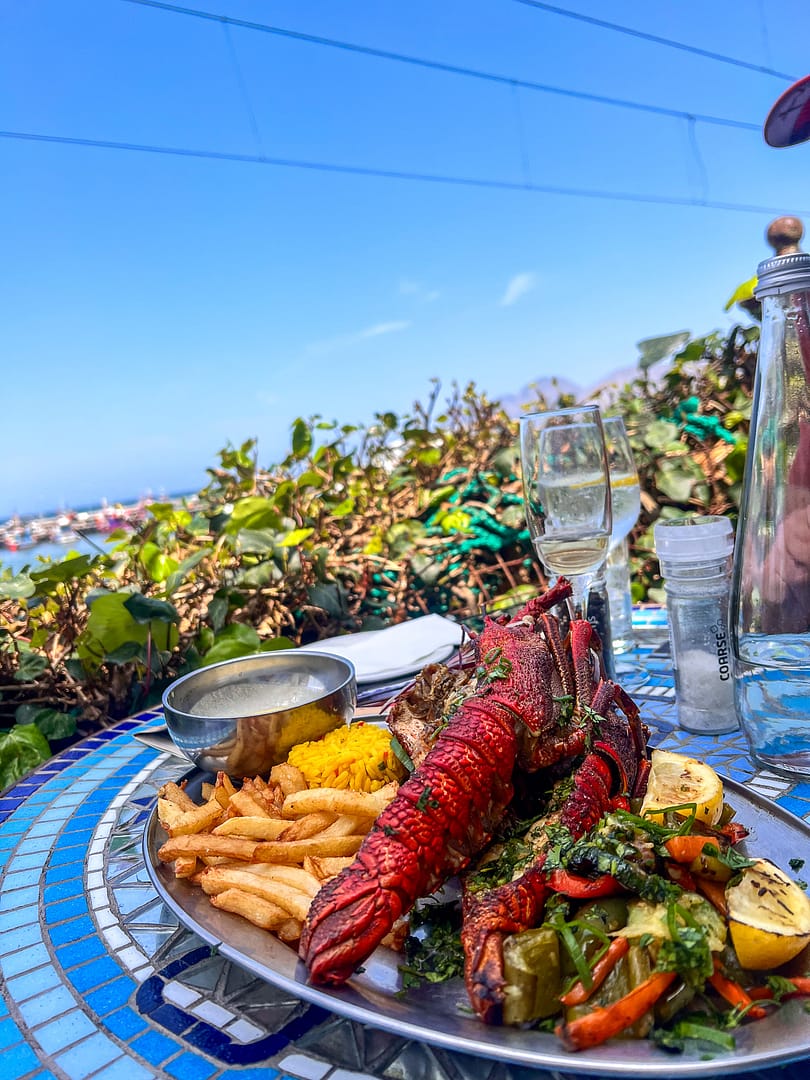 Crayfish on a place at a restaurant on the railway lines in Kalk Bay - Cape To Cuba